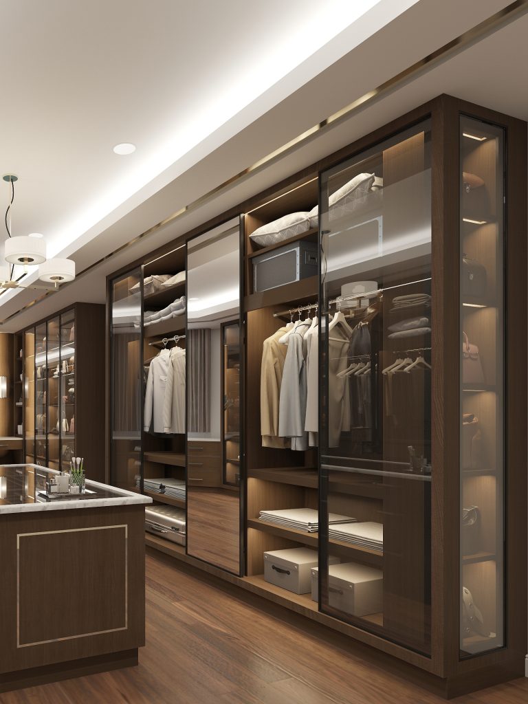 Custom walk-in closet system with shelving, drawers, and wardrobe units installed in Charleston home.